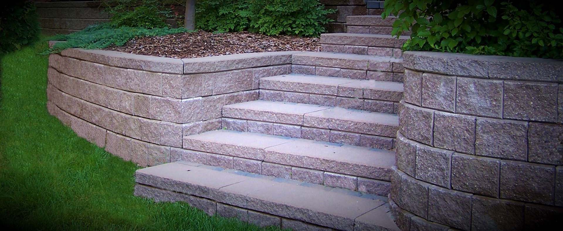 Stone steps with surrounding retaining wall.